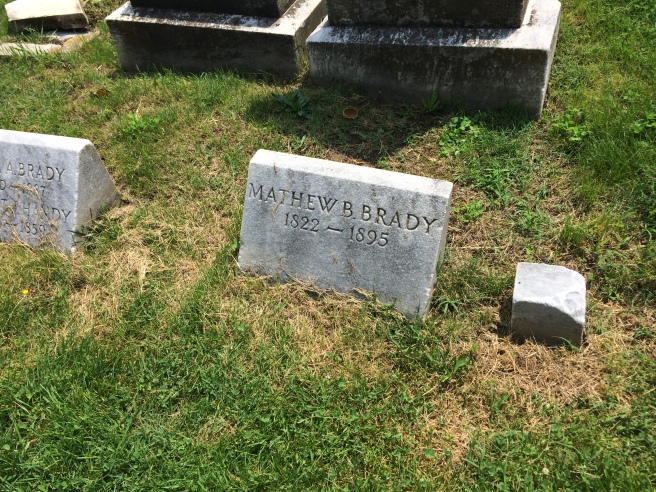 Brady's original stone, which is the at the top of the grave. The more recent stone is at the foot of the grave.